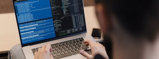 Man working on computer. Young it worker using laptop in the office, Internet marketing, technology, finance, business concept